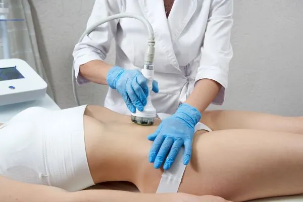 Lost the Weight but Not the Loose Skin? 2 woman having HIFU treatment on her stomach to combat loose skin Braintree following weight loss